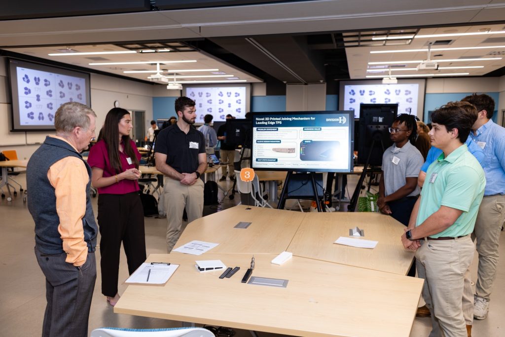 students discussing their senior design project based on hypersonics